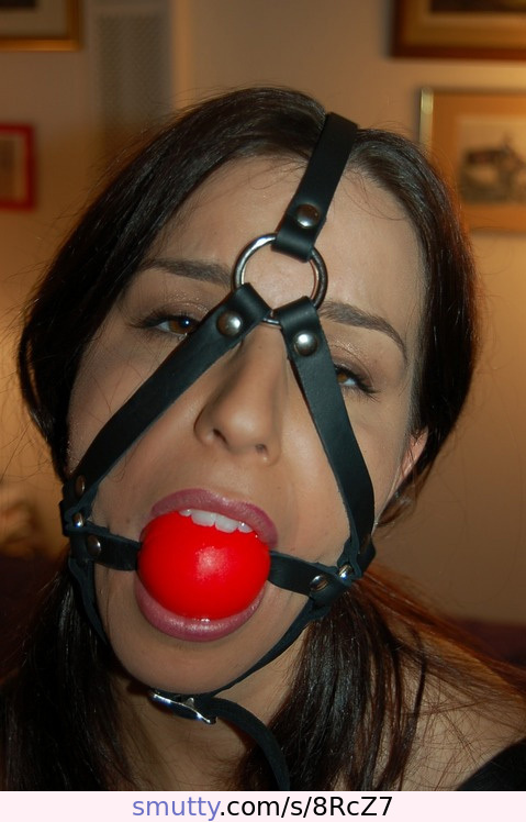 #submissive#gagged#ballgag#ballgagged#harnessed#headharness#solosub#faceonly#closeup#redballgag#browneyes#brunette#strapsovereyes#chinstrap