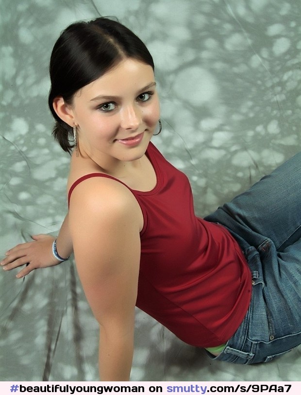 #beautifulyoungwoman#alluring#tempting#enticing#enquiringeyes#perfectcomplexion#seated#leaningback#lookingup#burgundytop#jeans#mischievous