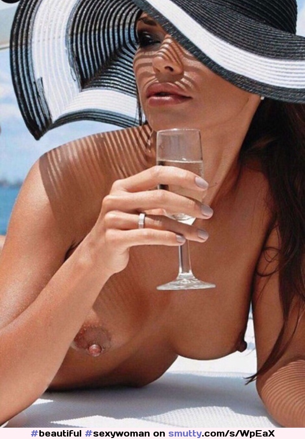 #beautiful#sexywoman#atthebeach#nicetits#sippingchampagne#sunhat