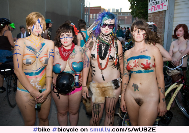 #bike #bicycle #cyclerotica #outdoor #public #bodypaint #smile #smiling #sunglasses #shorthair #redhead #beer