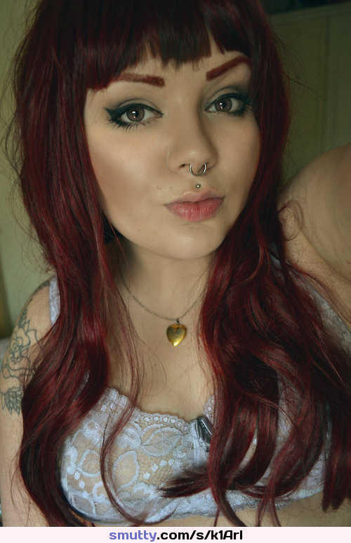 #redhead #longhair #gorgeouseyes #eyemakeup #selfshot #pursedlips #nosering #paleskin #tattoos #bra #lace #locket