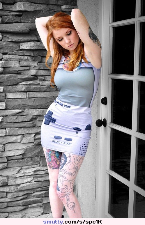 #redhead #posing #armsabovehead #gameboy #shortdress #clingydress #roundtits #curves #figure #hourglass #hips #tattoos #longlegs #thick