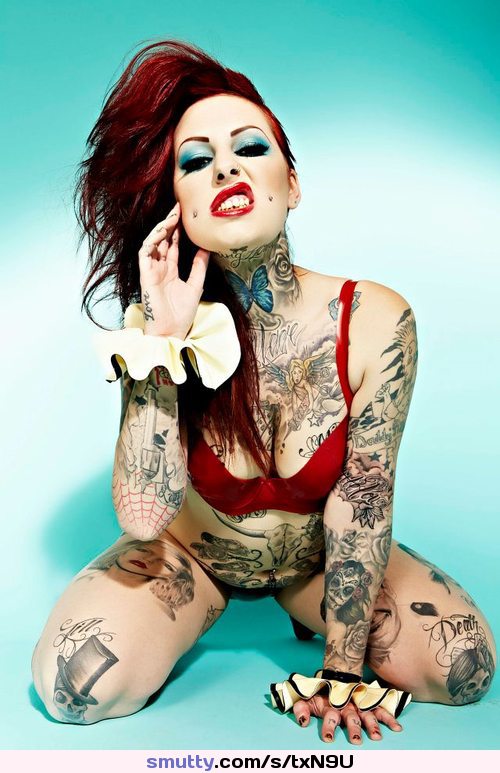 #punk #sneer #piercings #redhead #makeup #tattoos #redlips