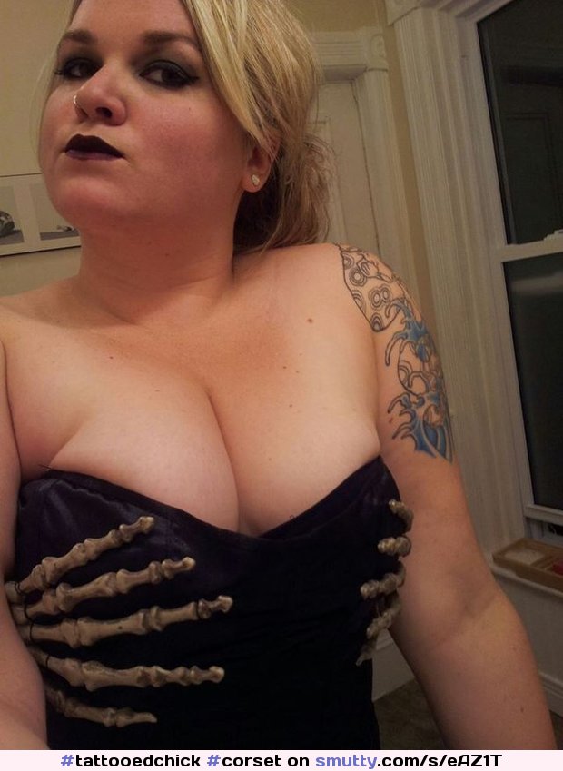 An image by: titsandtats - #corset #skeletonhands #curvy #blonde #bigboobs #tattoos #tattooedchick