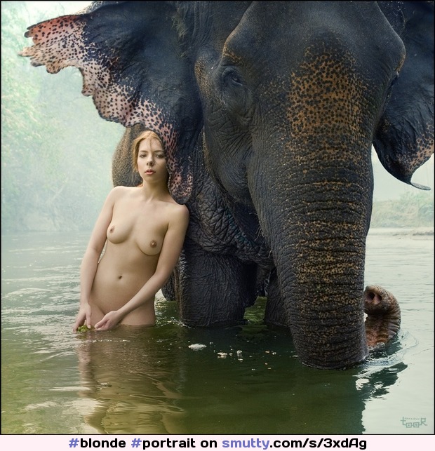 a #portrait of a #blonde girl in the water with an elephant