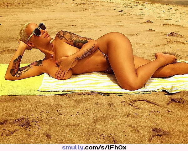 #AmberRose #lying #beach #coveringtits #iwantthatnow #blonde #tattooed #widehips
