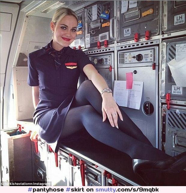 #pantyhose #skirt #airplane #airhostess #hostess #stewardess #heels #blonde #pose #plane