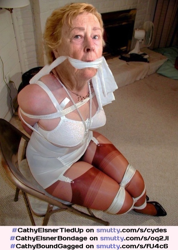#CathyBoundGagged    Cathy Slut Granny Helpless Bondage Slut Tightly Rope Bound and Gagged in Corset and Shiny Stockings Completely Tied Up