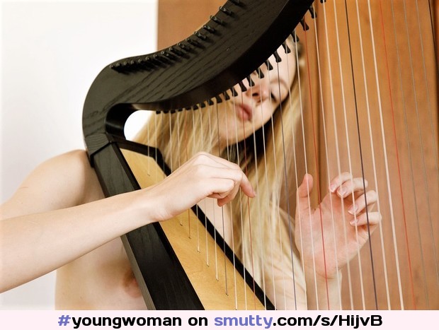 #youngwoman#enchanting#longblondehair#topless#smallbreasts#buttonnipples#harpist#playing#concentration#eroticimage
