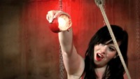 Strapped to a wooden pallet, @gisellehumes is under Mistress Irony's waxy wrath #waxplay #BDSM #fetish #girlongirl #strapped #sextoys